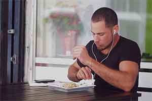 man eating headphones